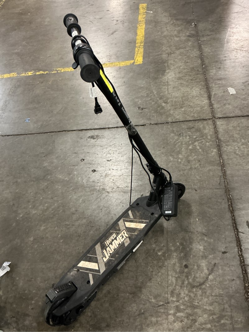 Condition photo showing As Is for hyper toy company, jammer 12v electric scooter, children ages 8+, up to 10 mph, 90w motor, black