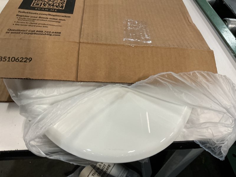Condition photo showing As Is for mayfair little2big? elongated plastic toilet seat in white with sta-tite? seat fastening system? and whisper•close? hinge