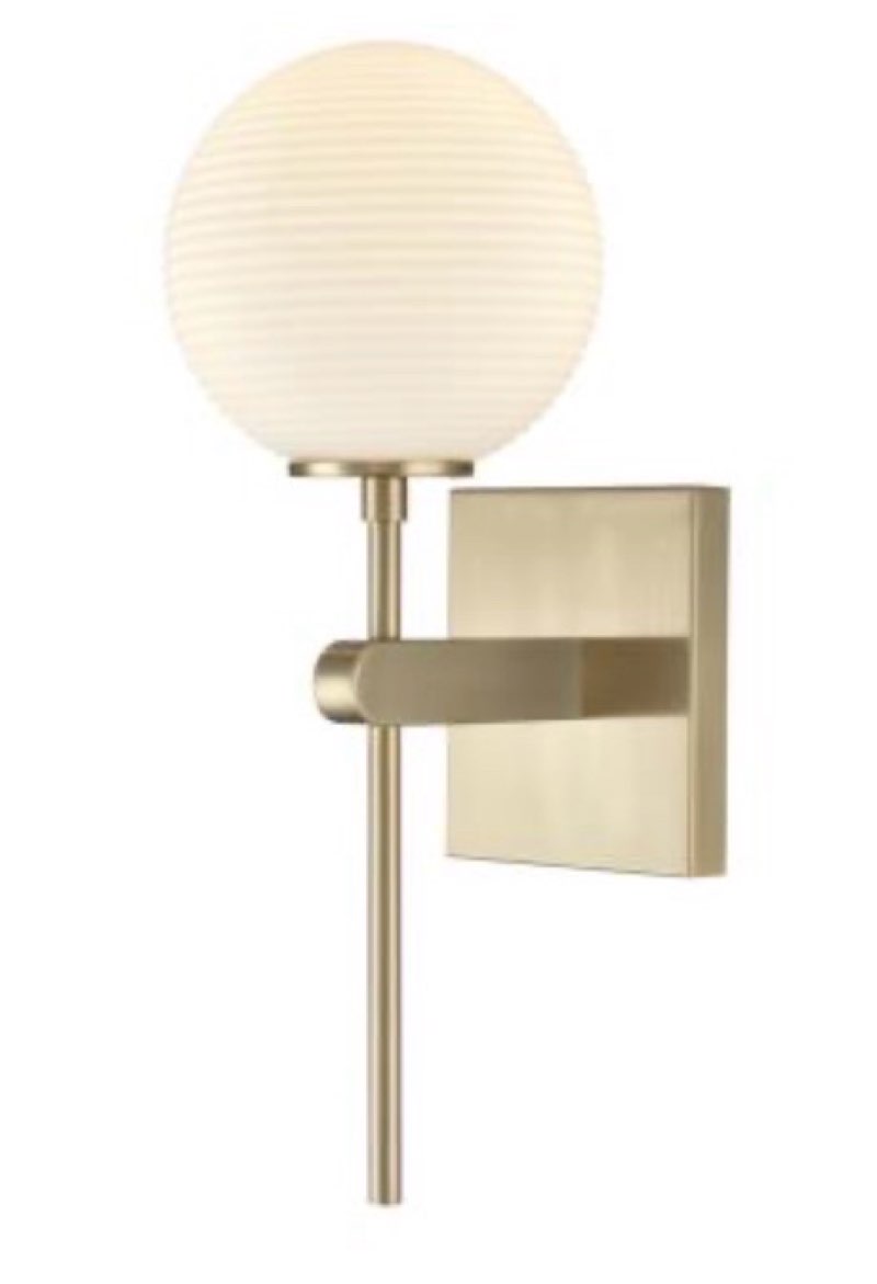 A modern reflection of classic Art Deco design, the Coretta Family features round, etched white glass globes set against bold fixtures finished in modern gold. The striking curves of the lighting components work in perfect harmony with clean lines of the backplate, creating a singular lighting experience perfect for any contemporary design scheme. Available as 1-light sconce, 3-light vanity, or 5-light island fixture, this collection is designed to impress.