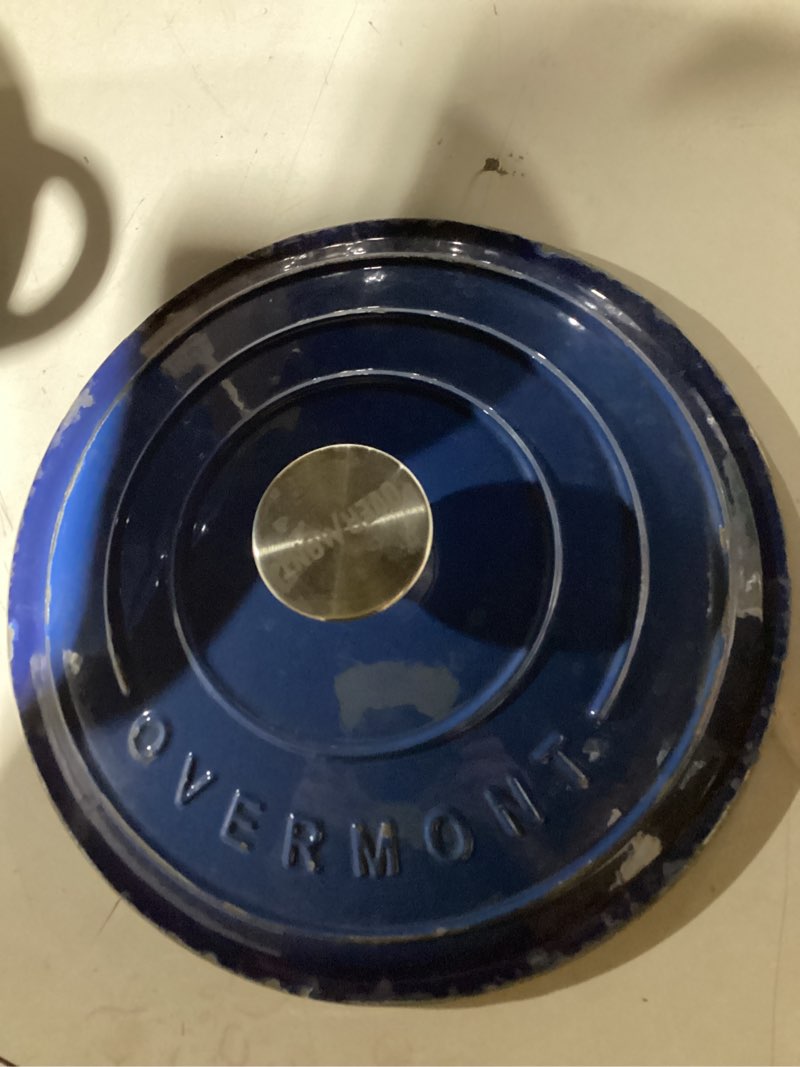 Condition photo showing As Is for Overmont Refined Enameled Cast Iron Dutch Oven - 5.5QT Pot with Wide Handles Lid Cookbook & Cotton Potholders - Heavy-Duty Pre-Seasoned Cookware Oven Safe to 500°F for Braising, Stews, Roasting, Bread Baking 5.5 Quart Sapphire blue