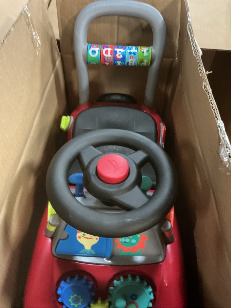 Condition photo showing Good Condition for Radio Flyer Busy Buggy, for Toddlers 1-3, 3-in-1 Push Walker Ride On Car with 17 Sensory Activities, Anti-Tip Feature, Under-Seat Storage, Horn and Gears, 42 lb Capacity, Toddler Ride On Toys Red