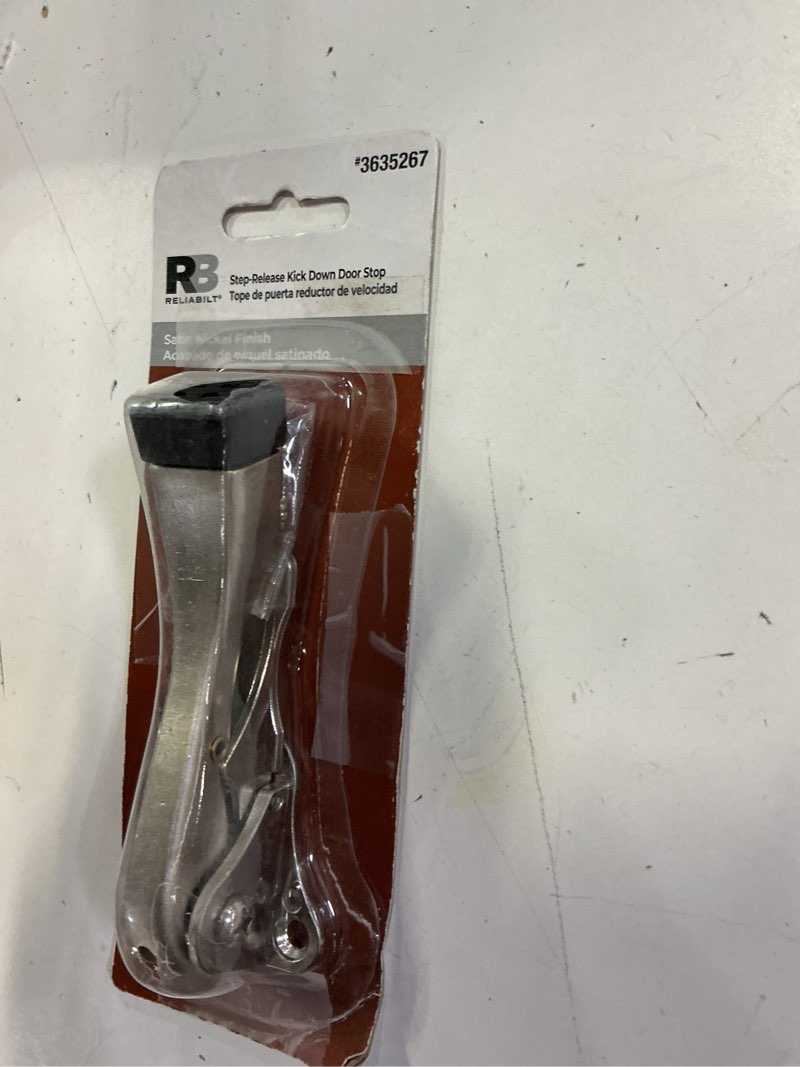 Condition photo showing As Is for reliabilt 4-3/4-in satin nickel kick-down door stop