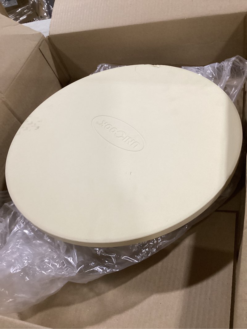 Condition photo showing As Is for Unicook Pizza Stone for Grill Oven, 15 Inch Round Baking Stone, Heavy Duty Cordierite Bread Cooking Pan, Thermal Shock Resistant, Ideal for Making Crisp Crust Pizza, Bread and More, Includes Scraper 15" Round