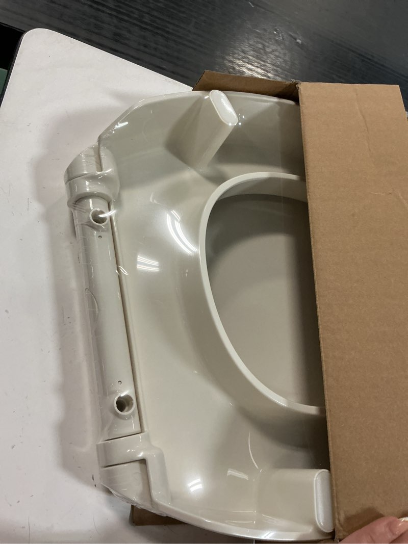 Condition photo showing Good Condition for KOHLER 25876-96 Hyten 3" Height, Elevated Soft Close Round Toilet Seat, Contoured Seat with Grip-Tight Bumpers, Quick-Attach Hardware, Biscuit Biscuit Round