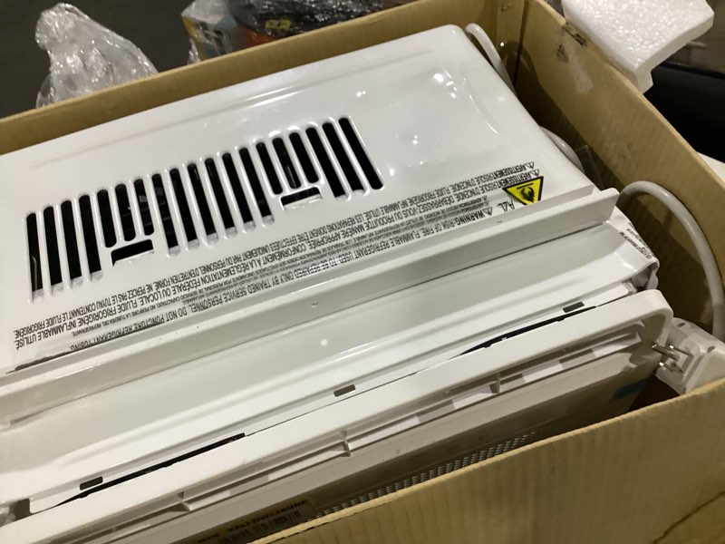 Condition photo showing As Is for 5,000 btu 115-volt window air conditioner 150 sq. ft. rooms with remote in white