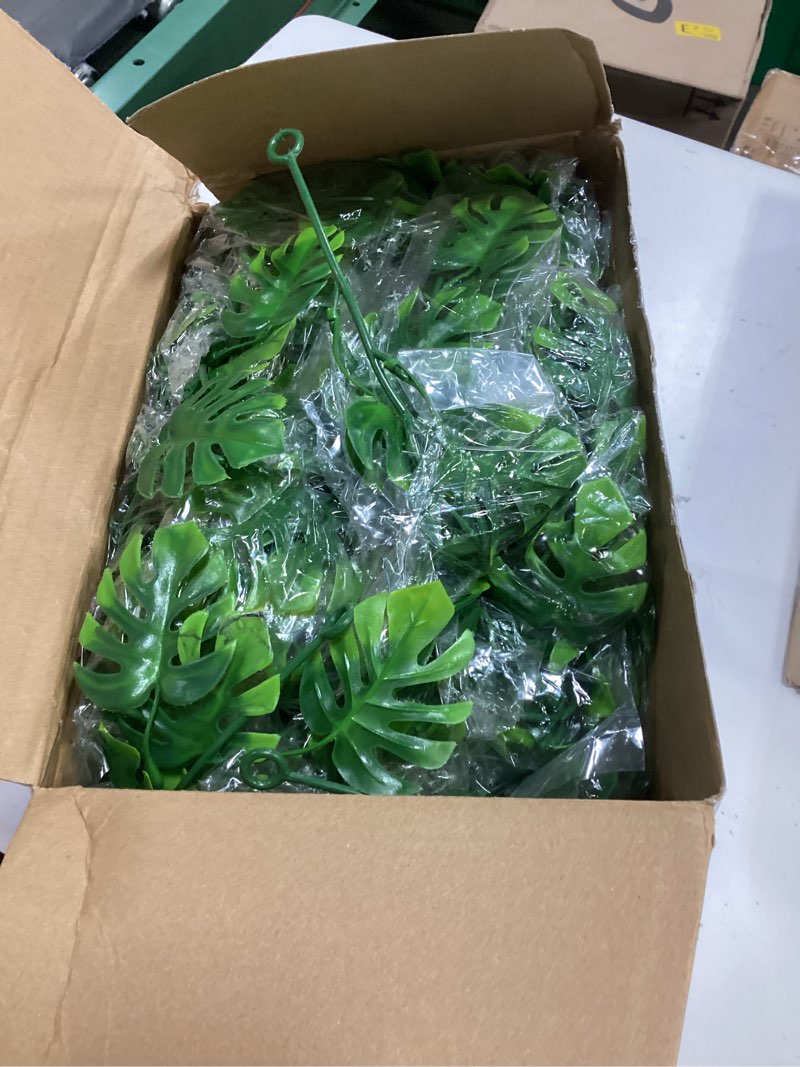 Condition photo showing New/Like New for zeyune 12 pcs artificial monstera leaf vines 5.9 ft fake hanging plant ivy tropical palm leaves greenery garland monstera faux vine for wedding party outdoor decor garden porch jungle hawaiian beach