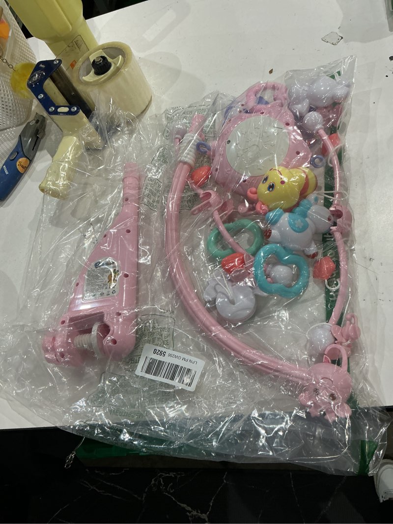 Condition photo showing As Is for baby mobile for crib with musicial and lights, remote and projection. pack and play toys for ages 0+ months (pink-bee)