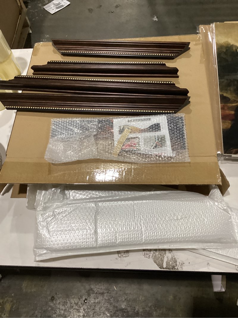 Mona lisa painting with brown frame gold trim