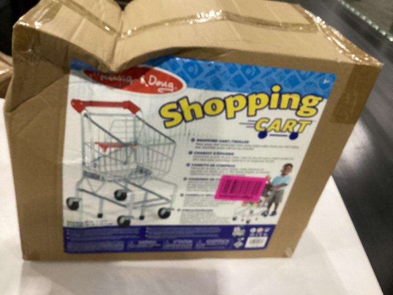 Condition photo showing New/Like New for Melissa & Doug Toy Shopping Cart With Sturdy Metal Frame