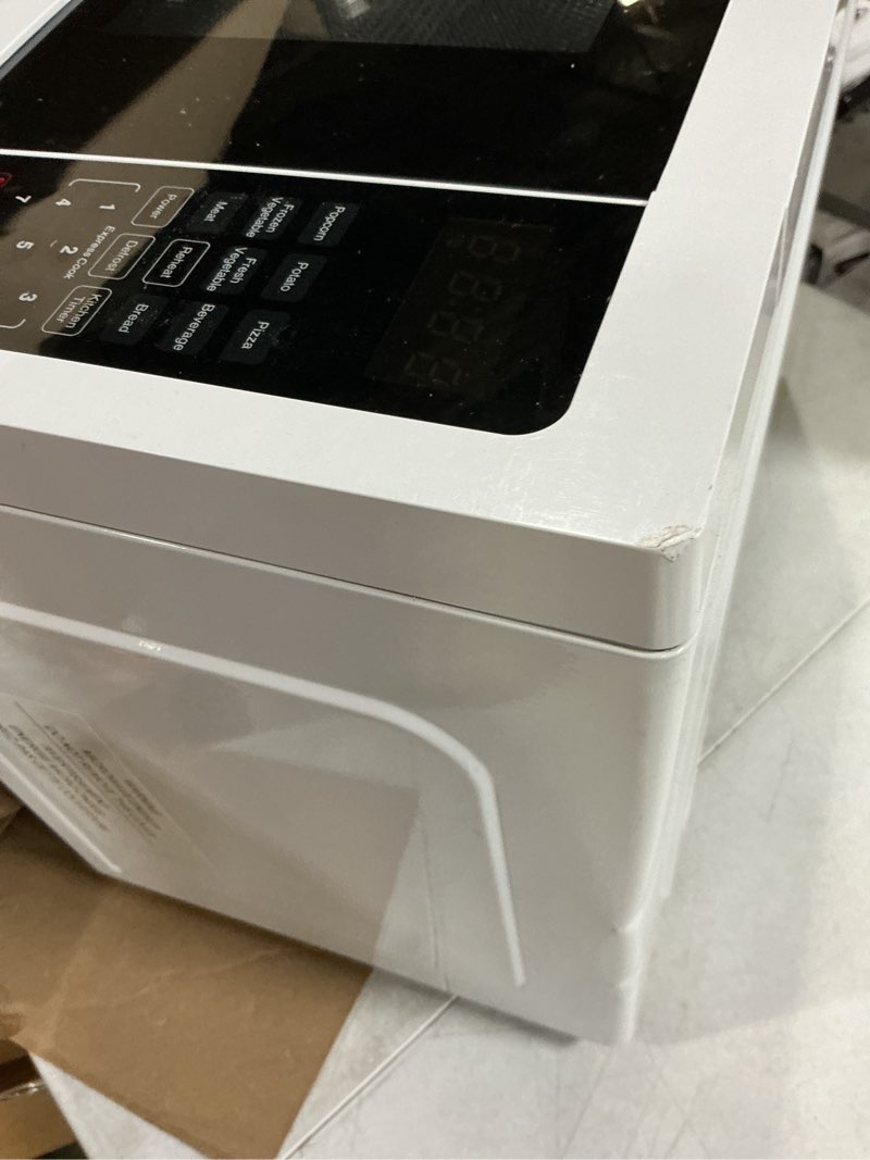 Condition photo showing As Is for farberware 0.7 cu. ft. countertop microwave oven – 700 watts power, auto cook settings, defrost, easy clean and child safety lock - white