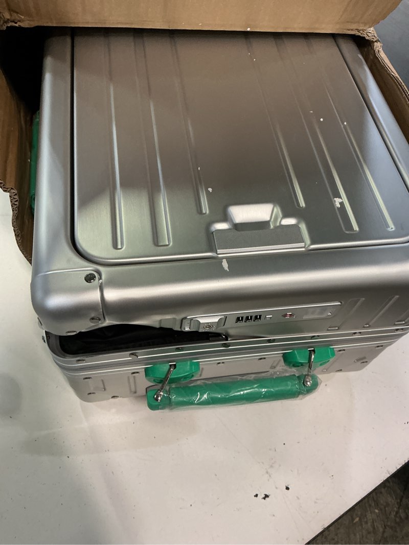 Condition photo showing As Is for 24 inch checked luggage with front compartment, all aluminum zipperless suitcase with jelly wheels & cup holder, silver-green hard shell luggage for travel silver-green 24in