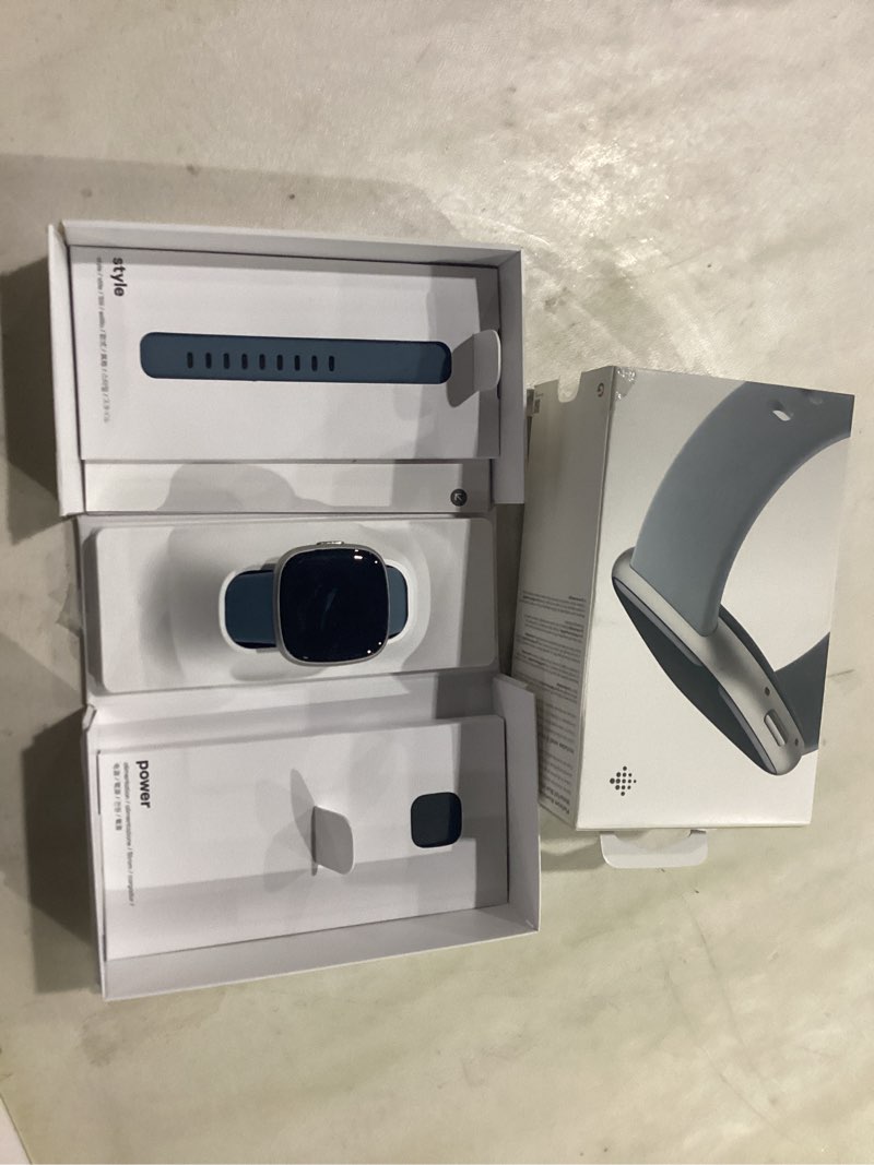 Condition photo showing As Is for MISSING CHARGER Fitbit Versa 4 Fitness Smartwatch with Daily Readiness, GPS, 24/7 Heart Rate, 40+ Exercise Modes, Sleep Tracking and more, Waterfall Blue/Platinum, One Size (S & L Bands Included)