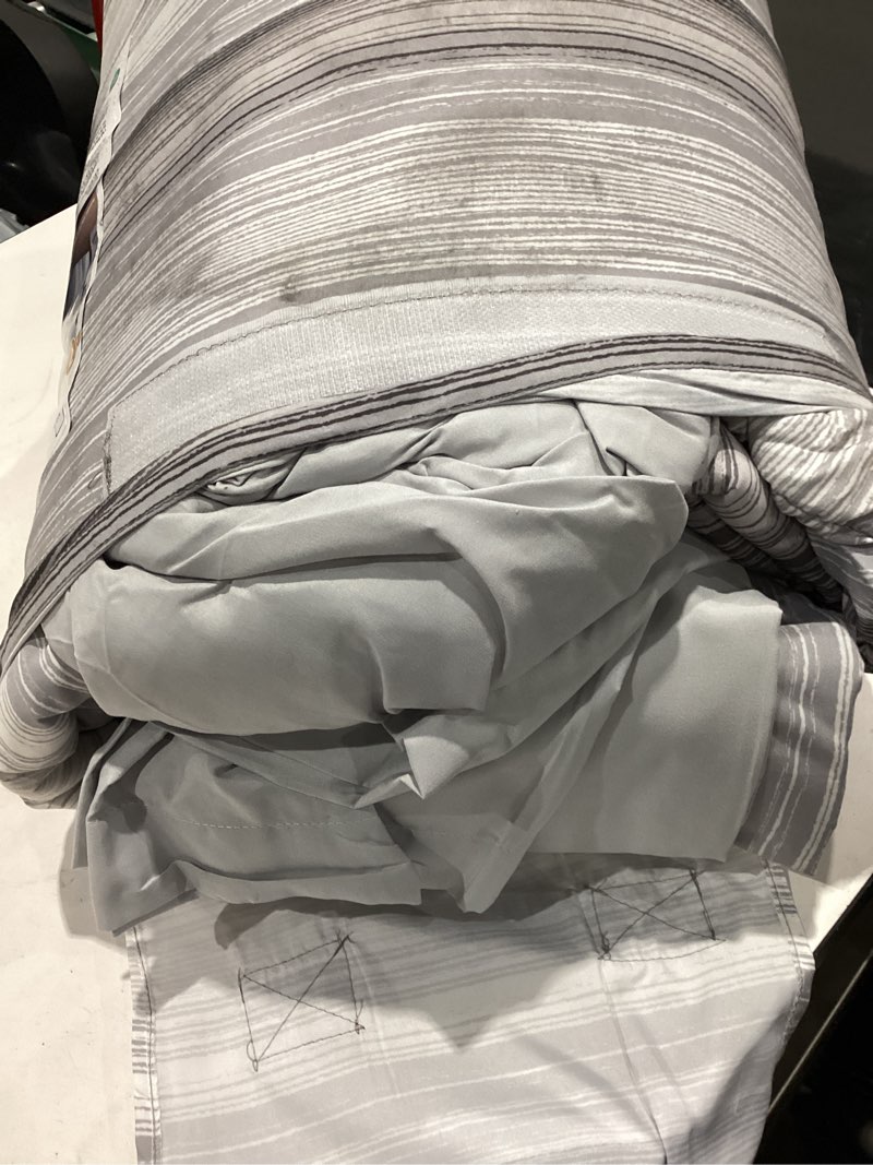 Condition photo showing As Is for mainstays all in one reversible comforter and sheet set- 7 piece, full, gray stripe