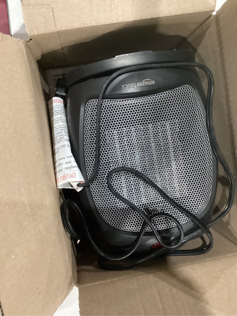 Condition photo showing As Is for amazon basics oscillating ceramic space heater, portable indoor heating solution, with overheat and tip-over protection, thermostat, 1500w, 7.52"d x 6.34"w x 9.45"h, black oscillating black