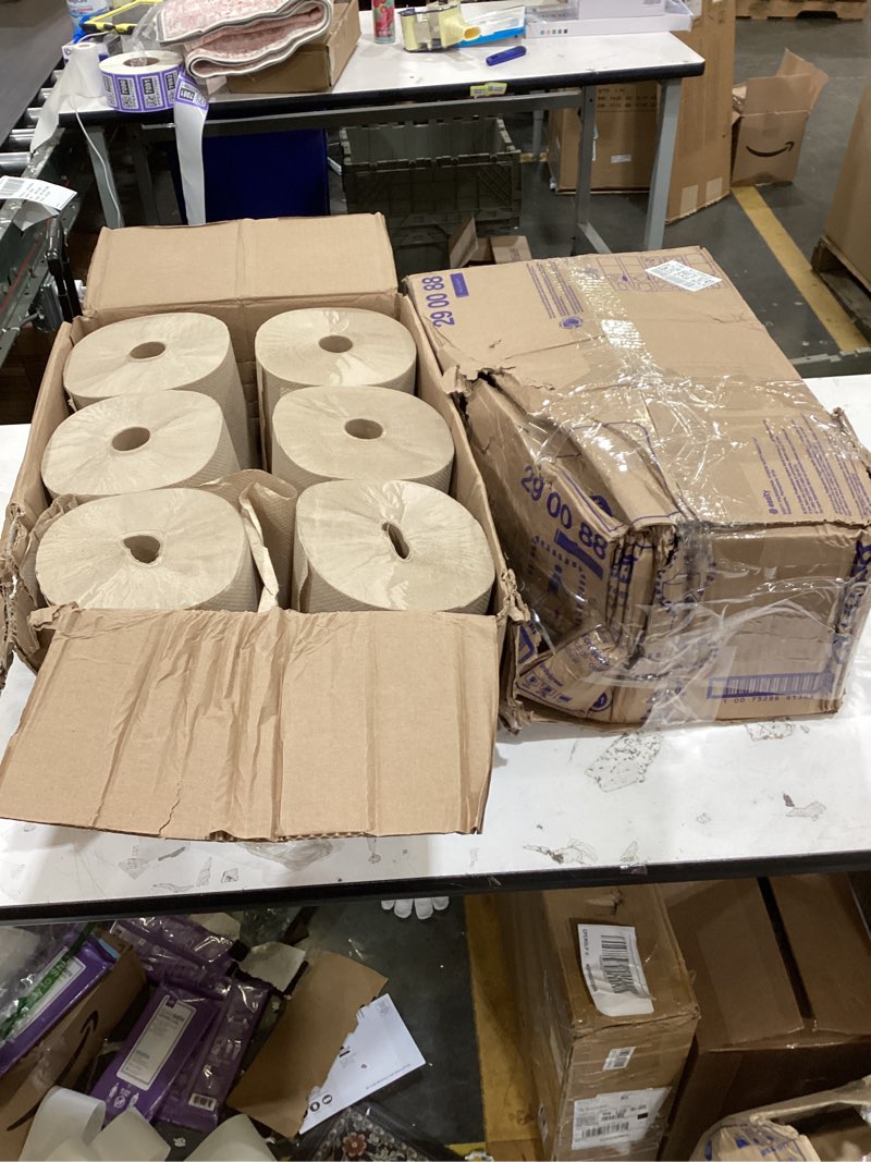 The image shows a box of Tork Matic hand towel rolls designed for high-traffic environments.  