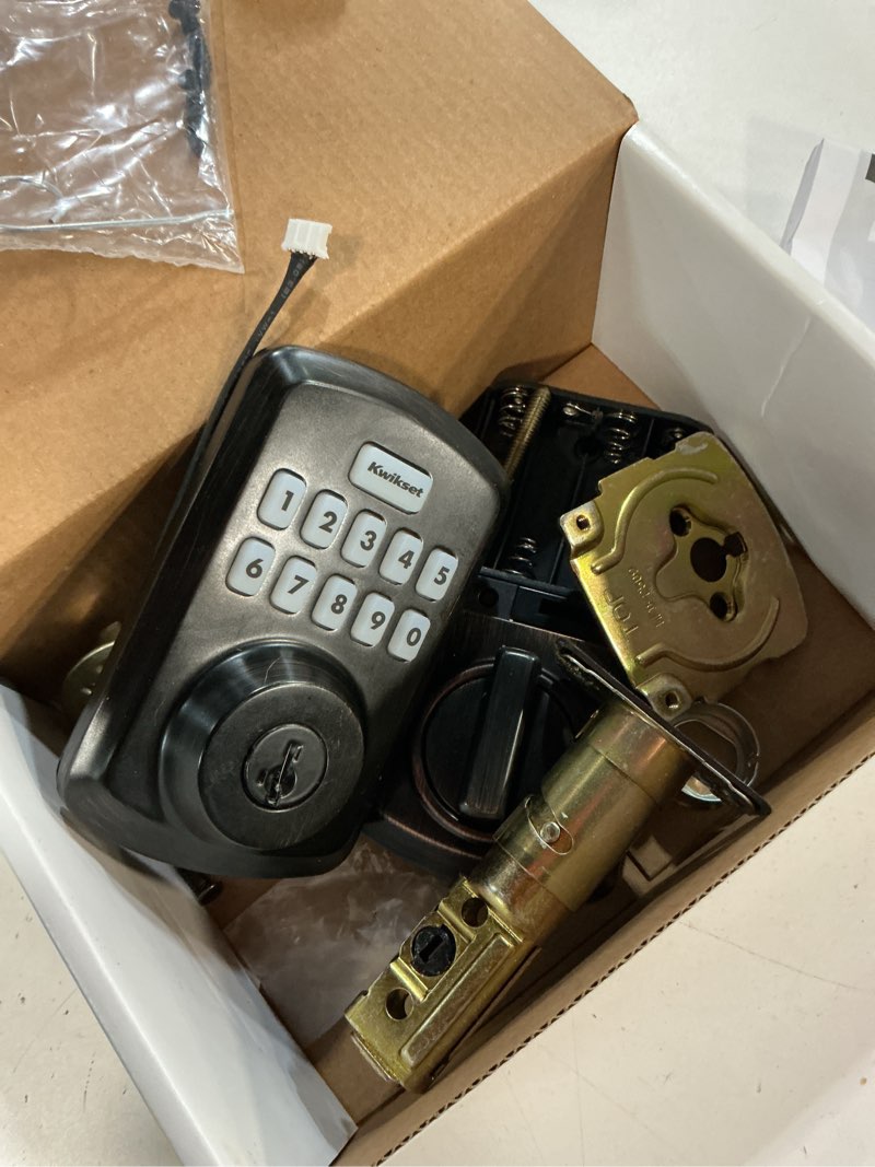 Condition photo showing As Is for kwikset 9250trs-11ps transitional powerbolt 2 electronic smartcode deadbolt smartkey with rcal latch and rcs strike venetian bronze finish