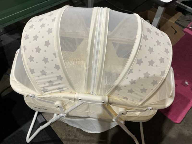 Condition photo showing Good Condition for dream on me karley bassinet in french white, quick fold and easy to carry, large storage basket