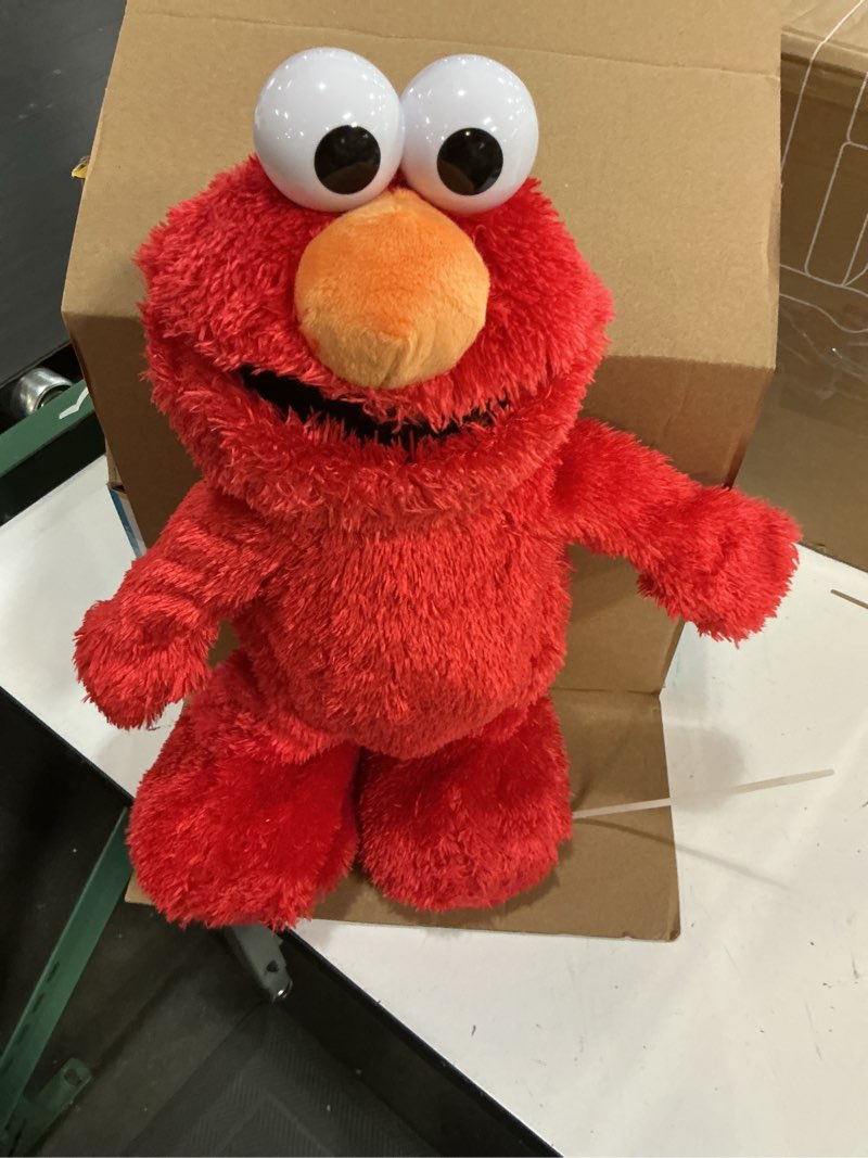 Condition photo showing Good Condition for sesame street hokey pokey elmo 14” interactive plush toy, sings, dances & plays music, bilingual stuffed animal for pretend play, soft & huggable, ages 18 months and up by just play