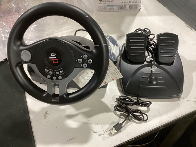 Condition photo showing As Is for subsonic - superdrive sv450 racing steering wheel with pedals and shifters. for xbox series x/s, switch 2 / switch, ps4, xbox one and pc - black