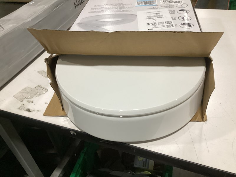 Condition photo showing Good Condition for kohler 25876-0 hyten 3" height, elevated soft close round toilet seat, contoured seat with grip-tight bumpers, quick-attach hardware, white white round