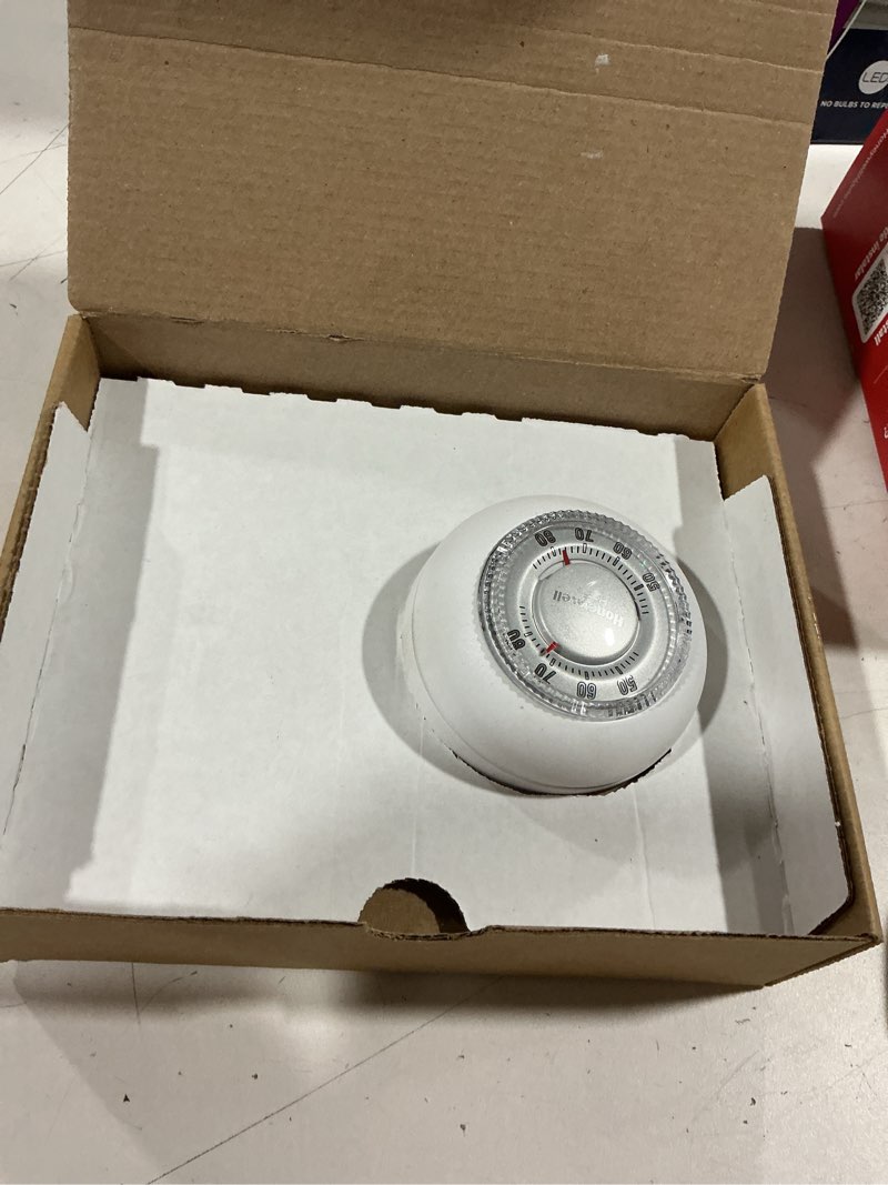 Condition photo showing As Is for honeywell home heating dial thermostat