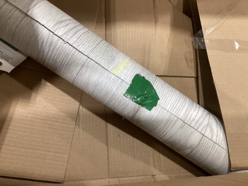 Condition photo showing As Is for Oxdigi Vinyl Flooring Roll Peel and Stick 24"x 118"/19 Sq.Ft, Self Adhesive Wood Planks Floor Sticker, Wear-Resistant Waterproof and Easy DIY Floor Covering for Kitchen, Bathroom, White Grey Wood 24"Wx 118"L White Grey Wood
