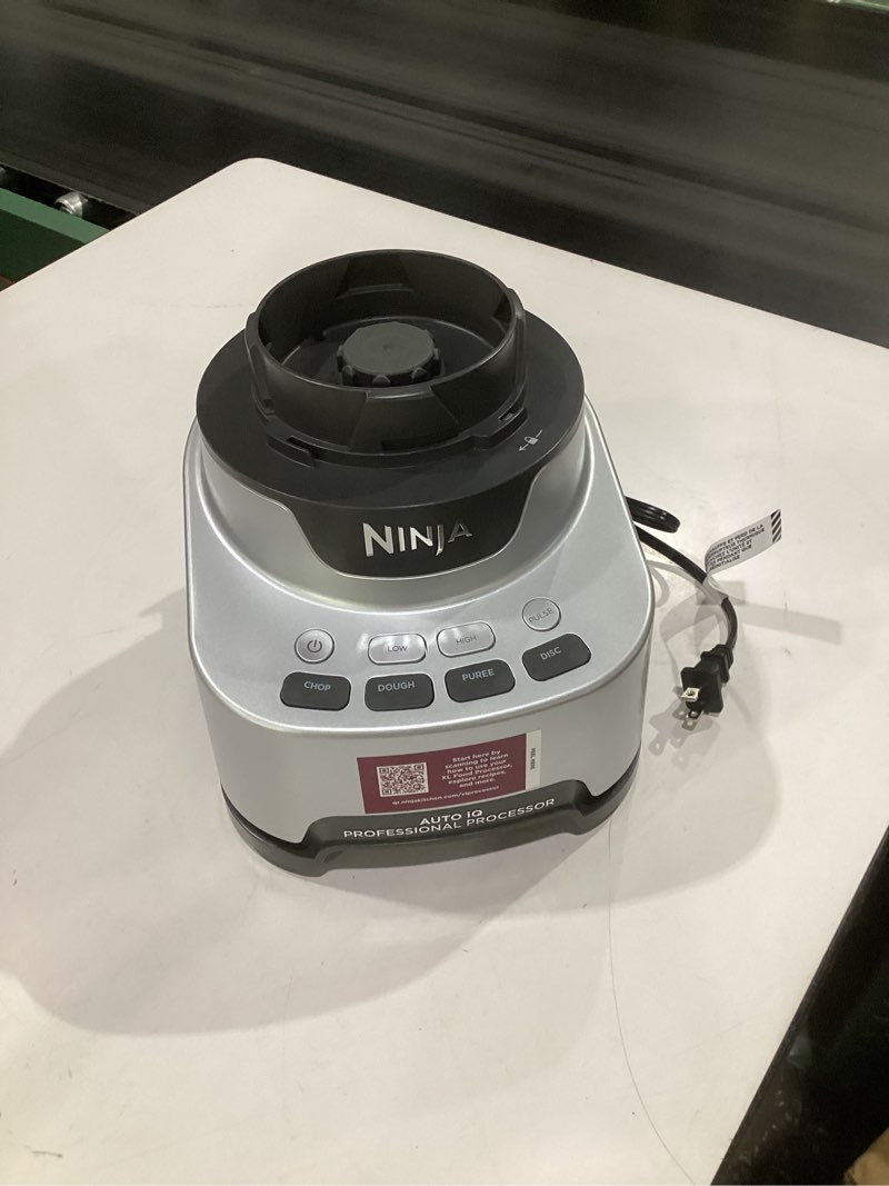 Condition photo showing As Is for (parts, just the base, not tested)ninja food processor, professional xl, 1200 peak-watts, 4-in-1, chopping, slicing/shredding, purees, dough, 12-cup processor bowl, 2 blades & 2 discs, feed chute/pusher, black, nf701 12-cup food processor