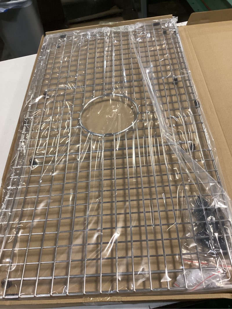 Condition photo showing New/Like New for serene valley sink bottom grid 29-1/2" x 15-9/16", centered drain with corner radius 3/8", sink protector ndg3016c