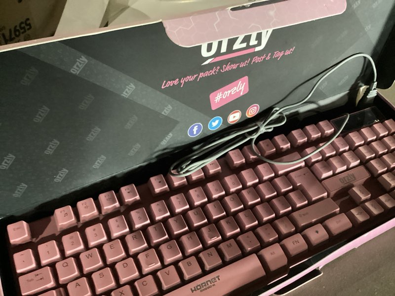 Condition photo showing New/Like New for Orzly Pink Gaming Keyboard RGB USB Wired Rainbow Keyboard Designed for PC Gamers, PS4, PS5, Laptop, Xbox, Nintendo Switch, RX-250 Hornet Edition
