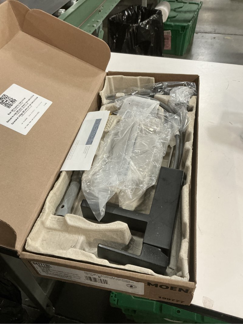 Condition photo showing As Is for Moen Revyl Matte Black One-Handle Single Hole Modern Bathroom Sink Faucet with Optional Deckplate and Spring Loaded Drain Assembly, 84771BL