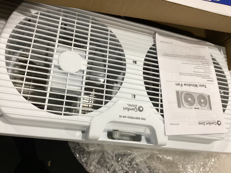 Condition photo showing Good Condition for *not tested* comfort zone twin window fan with reversible airflow control, 9 inch, auto-locking expanders, 2 speed fan, dual fan, exhaust, airflow 9.84 ft/sec, ideal for home, kitchen, bedroom & office, cz319wt white 9\"