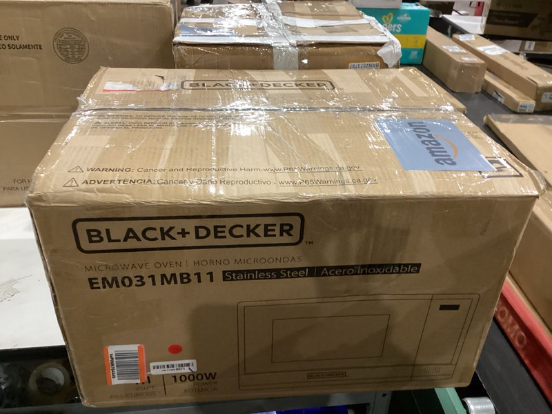 Condition photo showing New/Like New for BLACK+DECKER EM031MB11 Digital Microwave Oven with Turntable Push-Button Door, Child Safety Lock, 1000W, 1.1cu.ft, Black & Stainless Steel, 1.1 Cu.ft