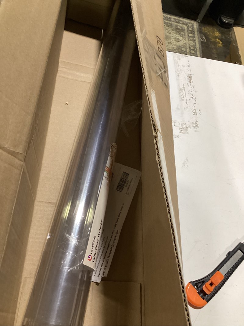 Condition photo showing Good Condition for lovepads clear table cover protector, 28 x 48 inch 2mm thick plastic table cover, table protector for dining room table, waterproof dresser cover top for kitchen, coffee, writing desk 28" x 48" (rectangular) clear 2mm