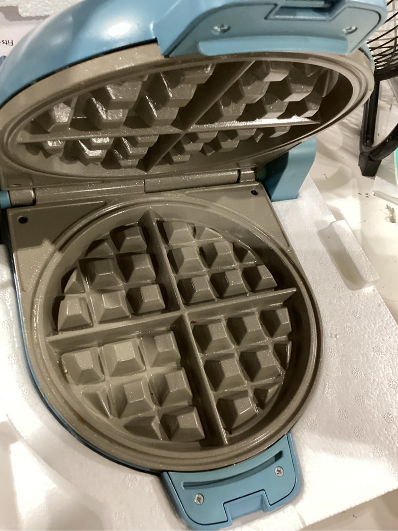 Condition photo showing As Is for bella flip-n-store waffle maker, evergood™ ceramic nonstick coating, fits-anywhere™ kitchenware, power indicator light & touch handle, 7” wide & 1" deep plates, 1000 watt, surf surf 7