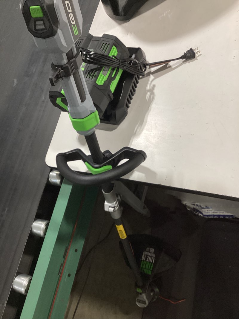 Condition photo showing As Is for ego powerload 56-volt 15-in telescopic shaft battery string trimmer 2.5 ah (battery included) (charger included)