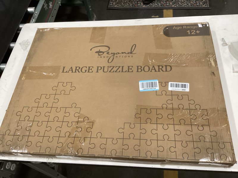 Condition photo showing New/Like New for 1000 Piece Rotating Puzzle Board with Drawers and Cover - 4 Drawers, Wooden Jigsaw Puzzle Table | 30” X 22”| Jigsaw Puzzle Board - Portable Puzzle Tables for Adults and Kids by Beyond Innoventions