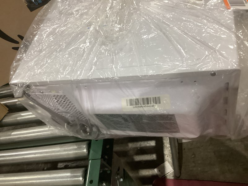 Condition photo showing As Is for BLACK+DECKER Compact Countertop Microwave Oven 0.7 Cu. Ft. 700-Watts with LED Lighting, Child Lock, White White 0.7 Cu. Ft.