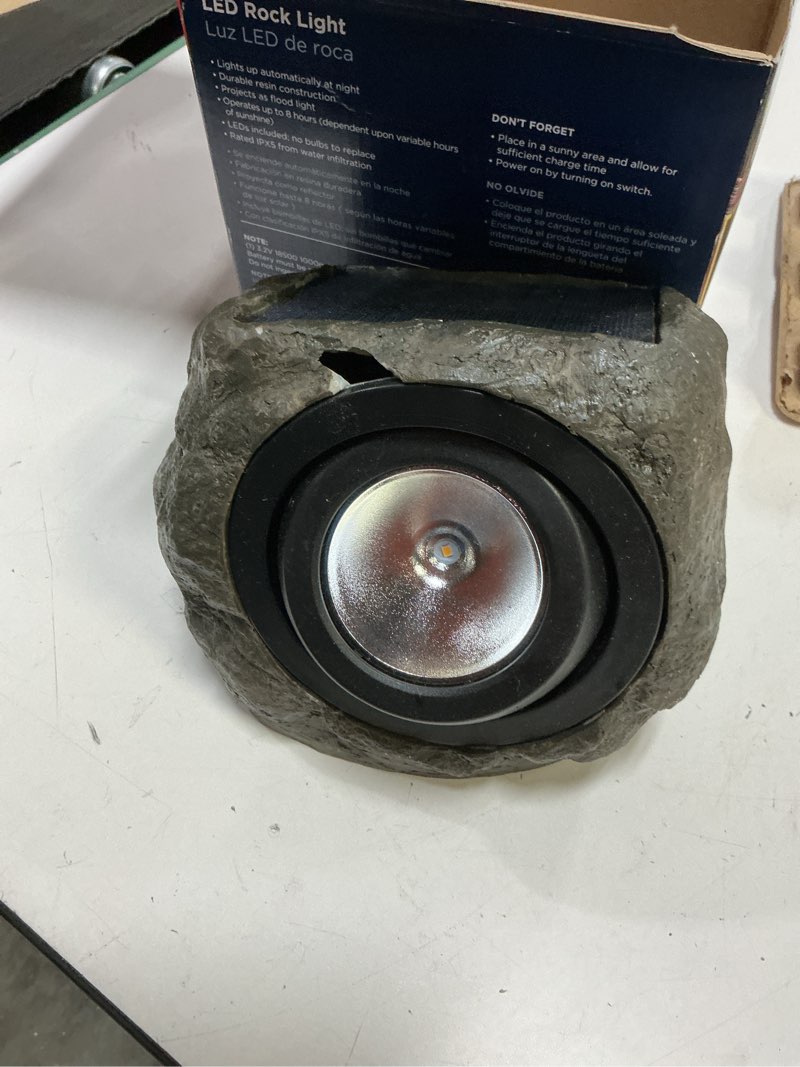 Condition photo showing As Is for harbr breeze rock flood light 40 -lumens 3.2 -watt grey solar led flood light