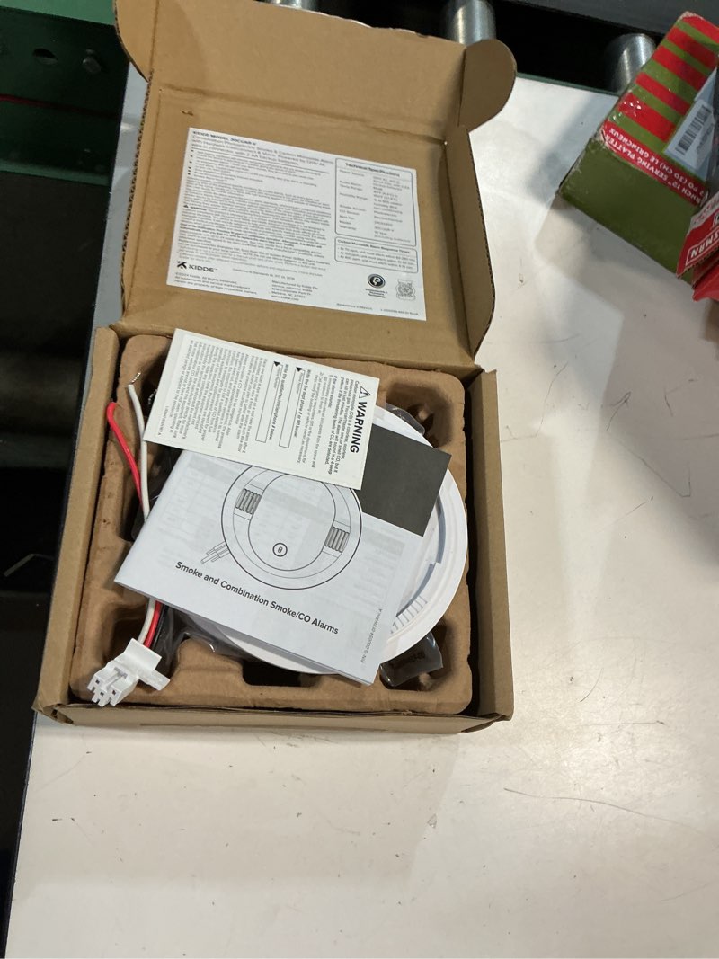 Condition photo showing New/Like New for kidde smoke and carbon monoxide detector, hardwired with aa battery backup, voice alerts, interconnectable, led status lights, 85 db alarm, 5-inches 1 pack 30cuar-v
