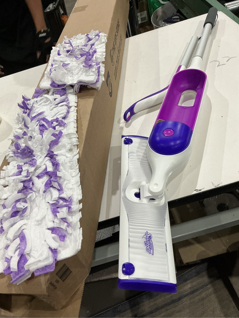 Condition photo showing As Is for swiffer powermop multi-surface mop kit for floor cleaning, fresh scent, mopping kit includes powermop, 2 mopping pad refills, 1 floor cleaning solution with fresh scent and 2 batteries purple and white