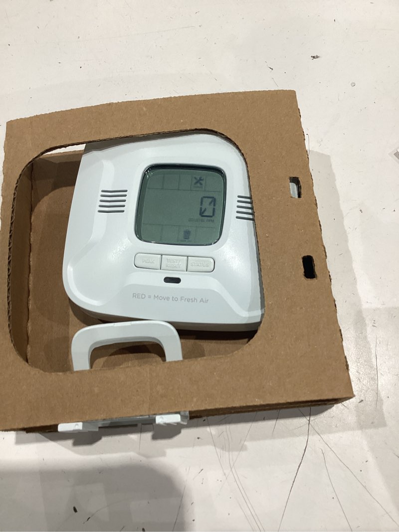 Condition photo showing As Is for battery operated carbon monoxide alarm, digital display, voice alerts, bilingual, ten year battery