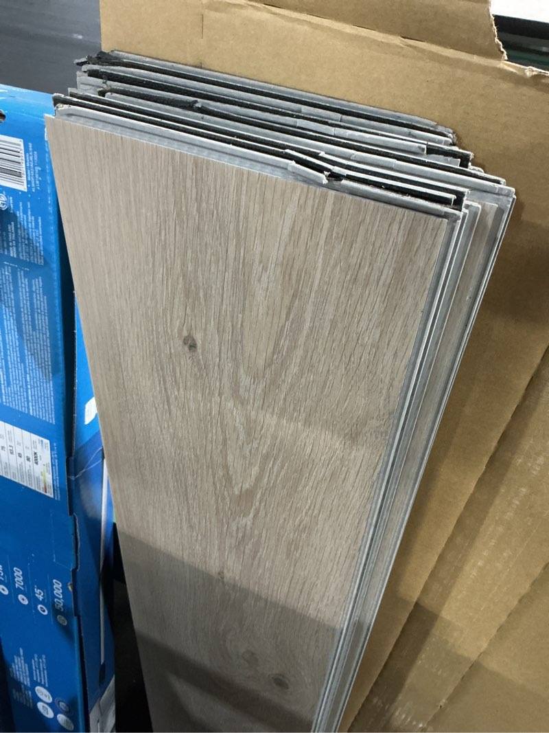 Condition photo showing As Is for style selections norwick oak 12-mil x 7-in w x 48-in l waterproof luxury vinyl plank flooring