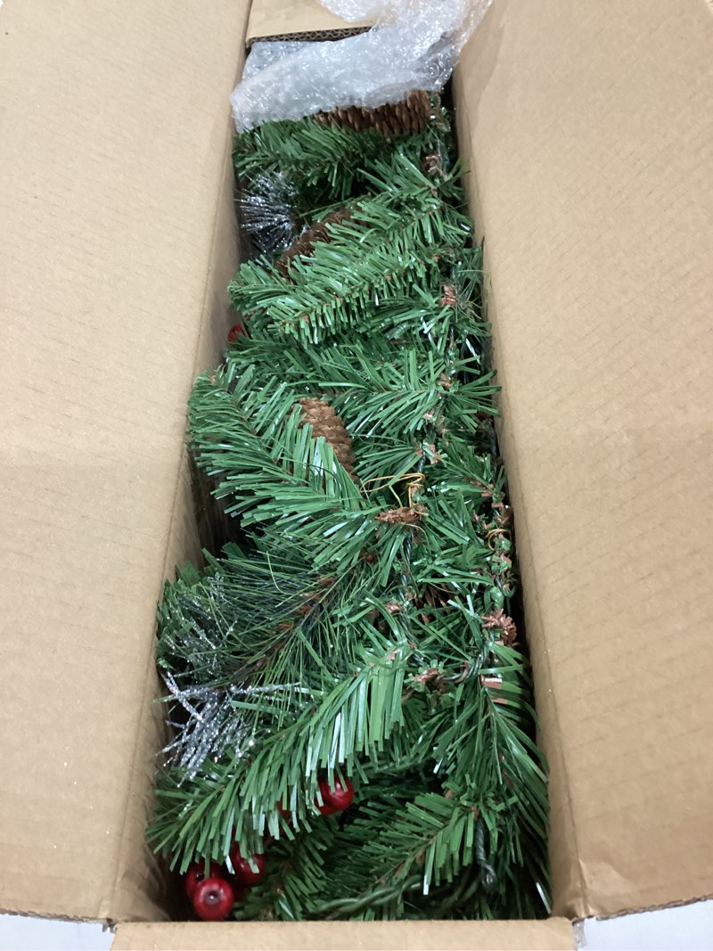 Condition photo showing Good Condition for national tree company 9 ft pre-lit crestwood spruce artificial christmas garland, christmas decoration with glitter, pinecones, red berries, 50 clear lights, 180 tips, green plug in tree