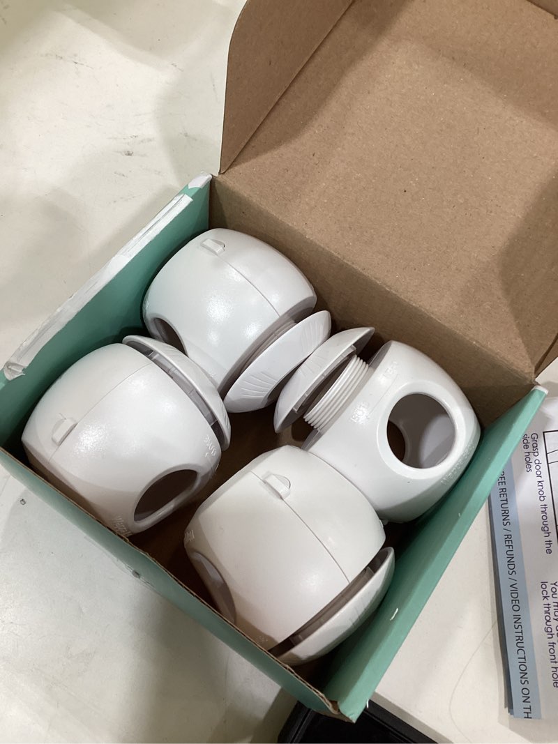 Condition photo showing As Is for Child Safety Door Knob Cover (4 Pack) Hard-to-Remove Dual-Lock Door Handle Covers for Kids - Reusable Baby Proof Door Knob Locks - Installs Easily, No Tools Needed (White) 4 White