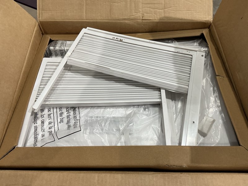 Condition photo showing As Is for amazon basics 6000-btu window air conditioner with quiet operation, up to 250 sqf, cool and fan functions, washable filter, adjustable window kit, digital temperature display, remote control, white