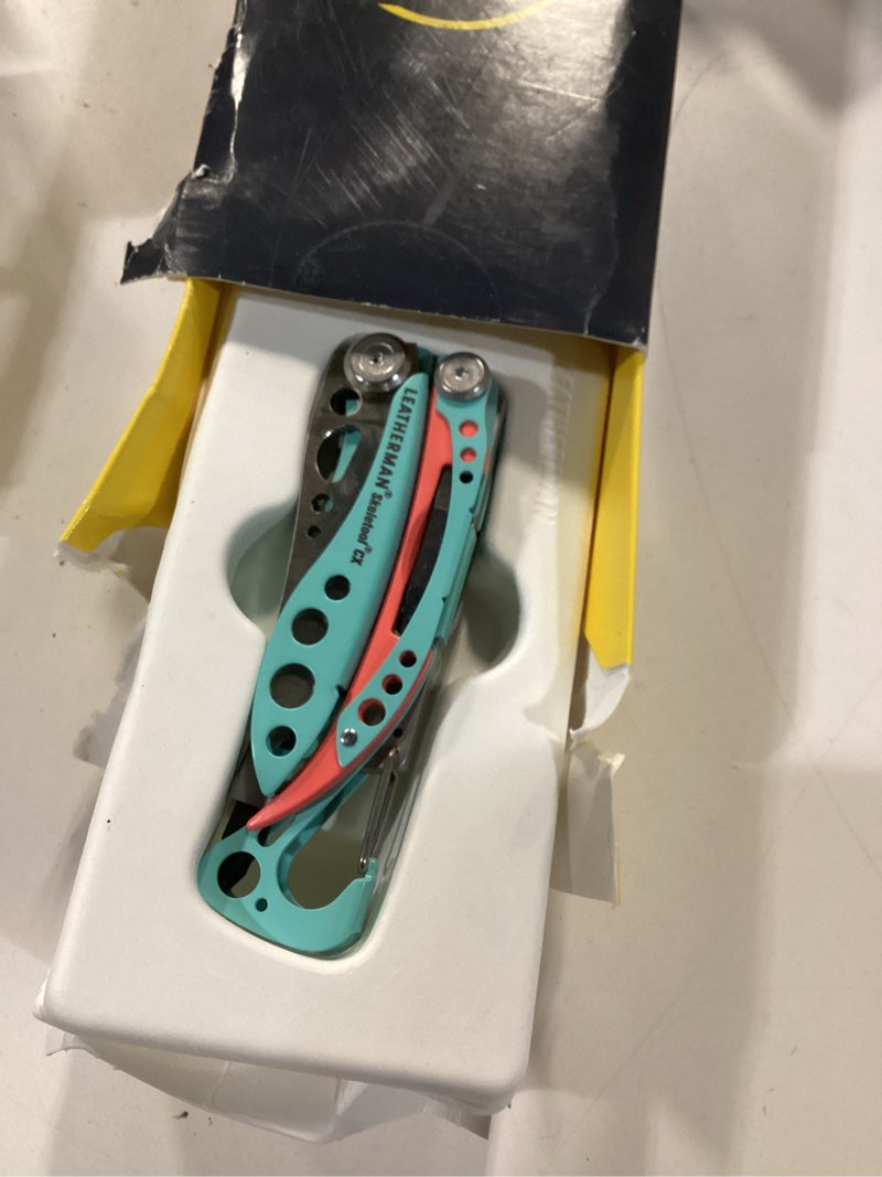Condition photo showing Good Condition for LEATHERMAN, Skeletool CX, 7-in-1 Lightweight, Minimalist Multi-Tool for Everyday Carry (EDC), Home, Garden & Outdoors, Paradise Blue