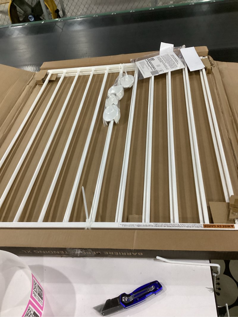 Condition photo showing Good Condition for Munchkin® Extending XL™ Tall and Wide Baby Gate, Hardware Mounted Safety Gate for Stairs, Hallways and Doors, Extends 33" - 56" Wide, Metal, White