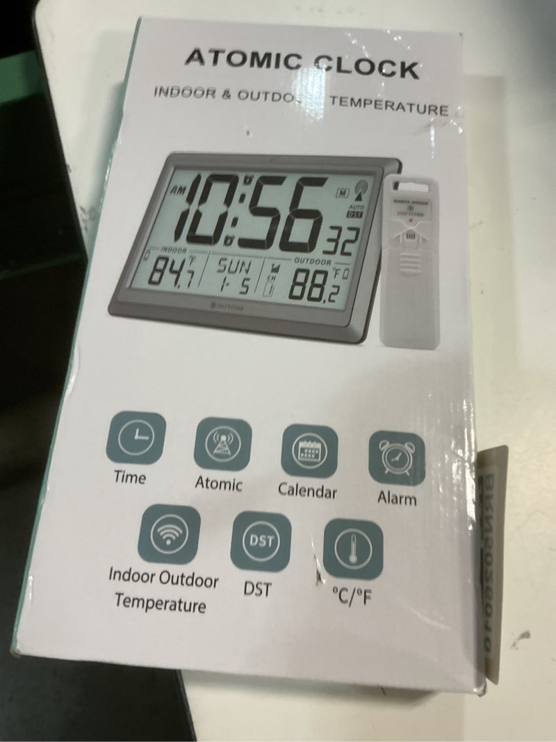 Condition photo showing New/Like New for atomic clock wall with indoor/outdoor temp, battery operated digital wall clock with 10.5" large lcd display, 330ft range desk table clock with alarm, dst, calendar for living room bedrooms, black black large