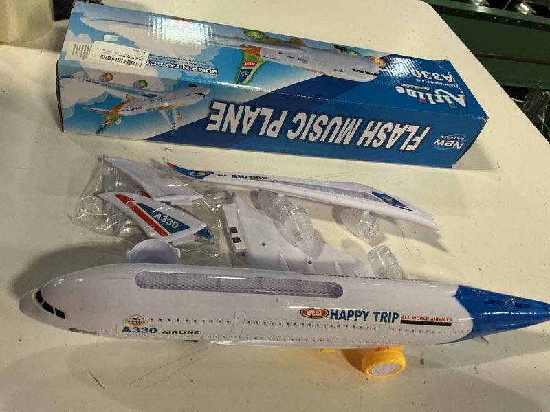 Condition photo showing New/Like New for airline toy airplane with music and led lights
