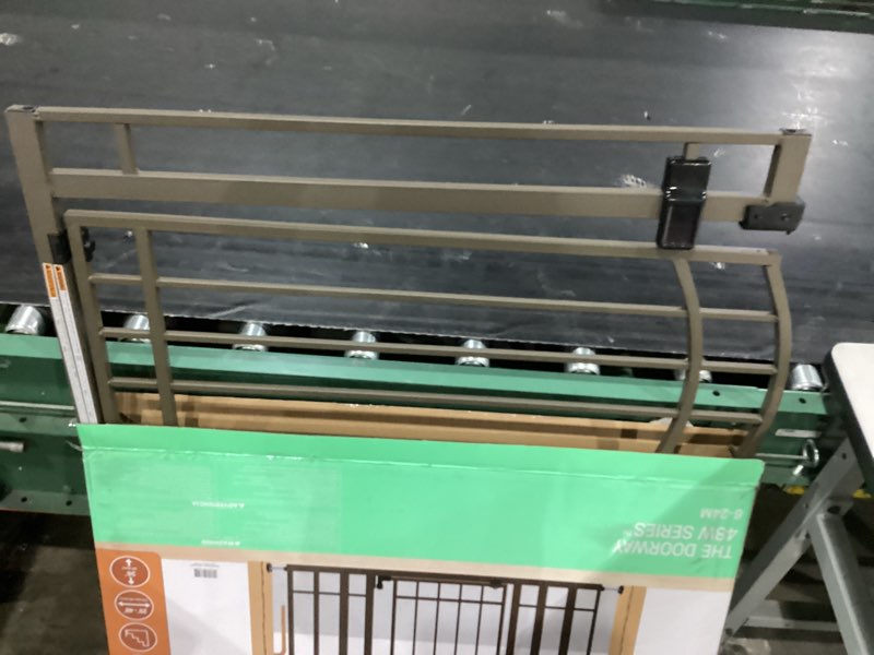 Condition photo showing As Is for ingenuity decorative extra tall baby gate & dog gate, 28.5"-48" wide, 36" tall, hardware or pressure mounted, install on top or bottom of stairs, banister, or doorway - bronze